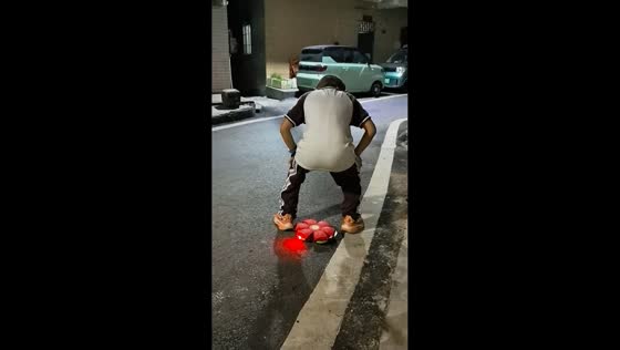 Boy plays with throw disc ball in Guangdong, China