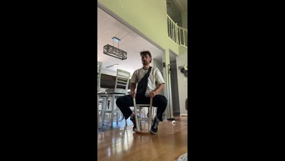 Man spins on flipped stool in Charlotte, North Carolina