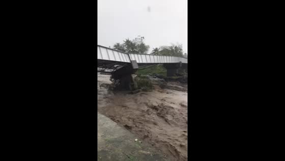 Bridge begins to collapse under floodwaters in Guinobatán, Albay, Philippines