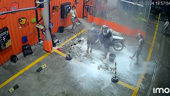 Car wash surprise: customers get a soapy bath in Suphan Buri, Thailand