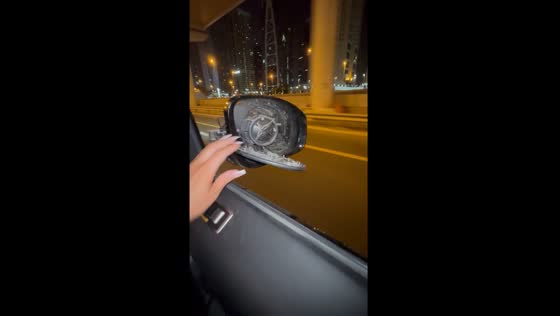Date night drive turns hilarious: Dubai dilemma as side mirror hangs on for dear life!