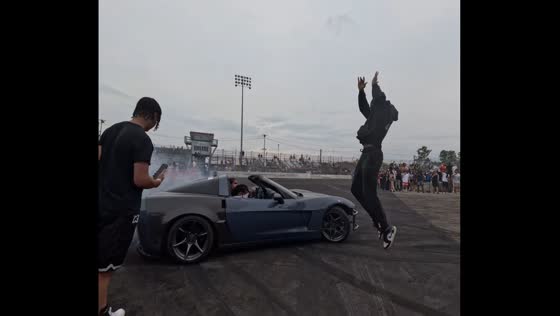 Man jumps over drifting car on Delancey Street in Manhattan, New York