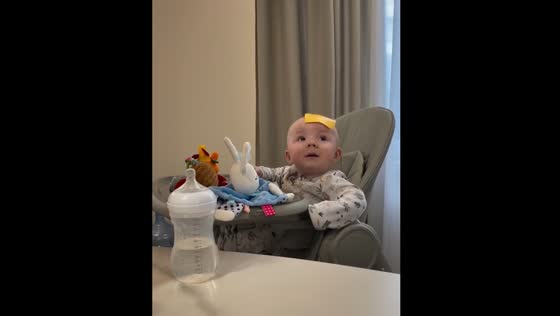 Child stops crying after cheese slice lands on their head