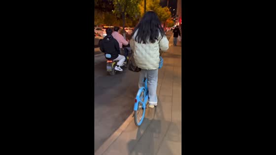 Woman rides shared bicycle without a seat in Liaoning, China