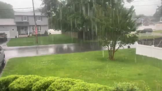 Intense rainfall soaks neighborhood in East Islip, New York, USA