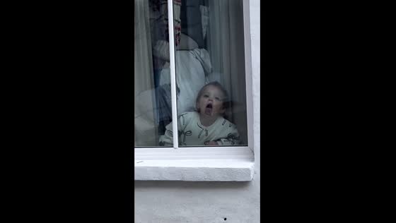 Toddler's tongue trip: window licking takes center stage