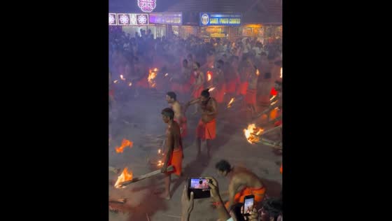 Devotees participate in 'Agni Keli' ritual in Mangaluru, Karnataka