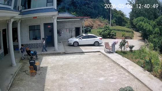 Person falls with rocking chair outside house in Sichuan, China