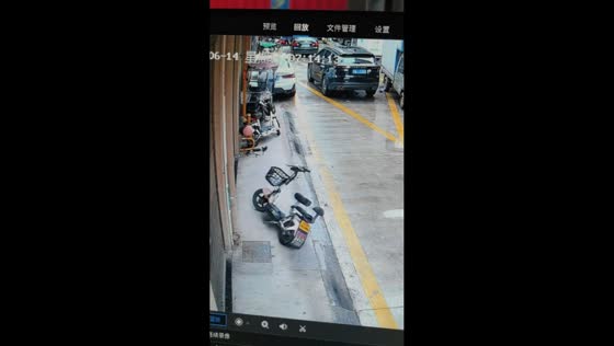 Bird lands on parked e-bike causing it to fall over in Zhejiang, China 