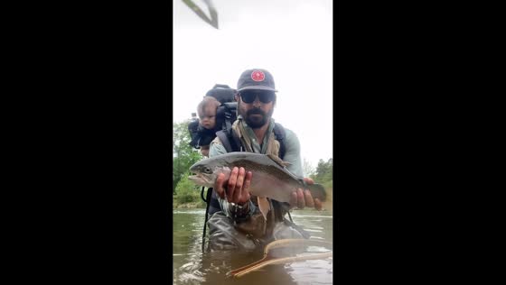 Father catches and releases trout with daughter on back in Broken Bow, Oklahoma