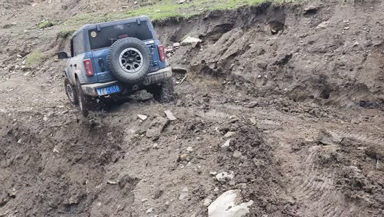 Driver navigates collapsed road in off-road vehicle in Xinjiang, China