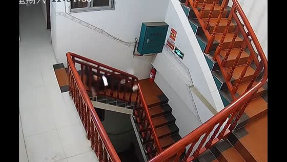 Person slips on stairs while using phone, Guangxi, China