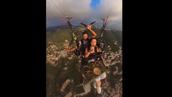 Eating while paragliding in Lebanon