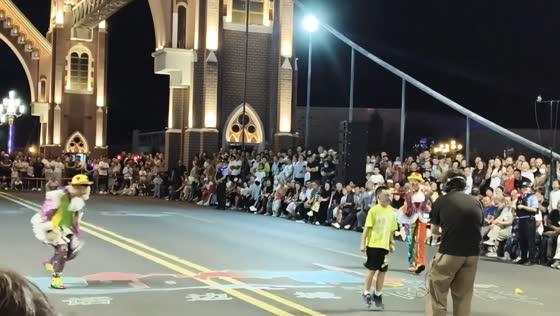 Blindfolded boy keeps jumping after rope trick at night performance in Xinjiang, China