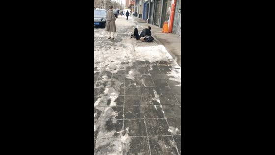 Winter stroll takes a slippery turn: icy mishap caught on camera in Heilongjiang, China