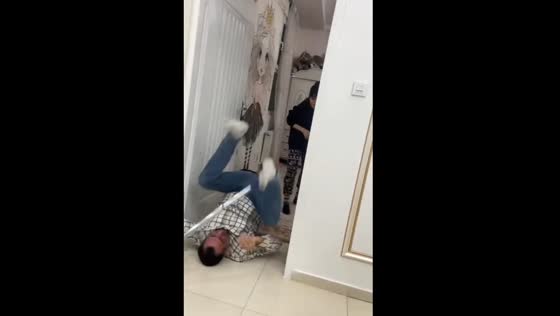 Husband falls while attempting backflip with iron rod in Iran