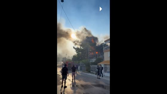 Powerful wildfire destroys homes and spreads through hillside in Salamina, Greece