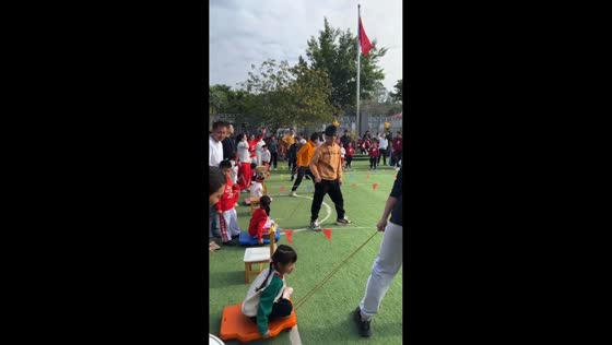 Child falls during a parent-and-child scooter board race in Guangdong, China