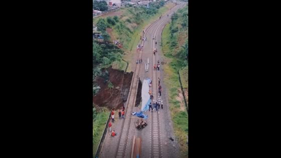 Devastating landslide strikes South Bogor District, leaving railway line hanging and villagers trapped in debris