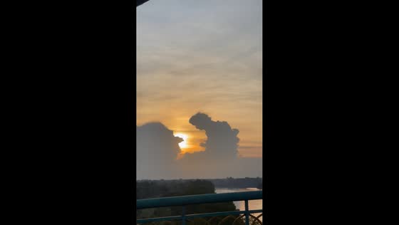 Cloud shaped like praying figure spotted during sunset in Siak Sri Indrapura, Indonesia