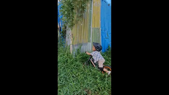 Child falls while biking at eco Islamic boarding school field, Indonesia