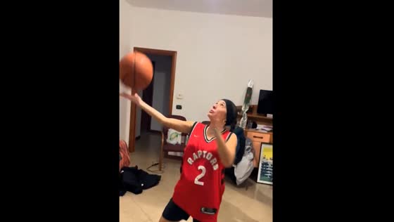 Trick shot gone wrong: basketball dribble shatters light at costume party