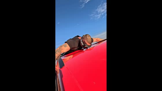 Man holds onto car at high speed during daring challenge in Rostov-on-Don, Russia