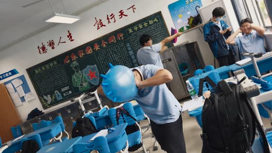 Student inflates rubber glove until it bursts in classroom in Shanghai, China