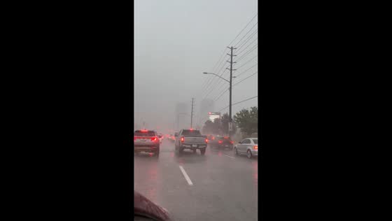Heavy rainstorm reduces visibility as cars crawl through Vaughan, Ontario