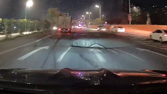 Driver avoids large hole on road in Guangzhou, China