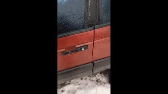 Frozen car door handle snaps in extreme cold in Pyatigory, Russia