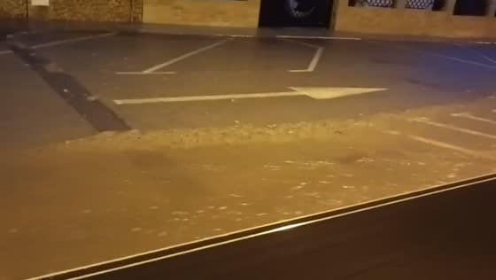 Torrential rain floods parking area during severe storm in Alcanar, Spain