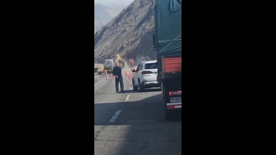 Falling rock hits excavator during roadwork in Arica, Chile