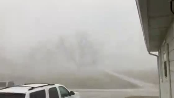 Sudden snow squall reduces visibility in Utica, Missouri, USA