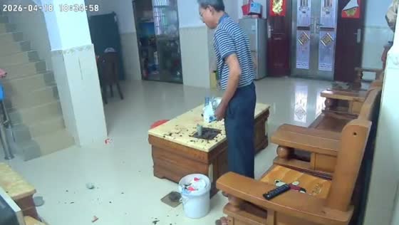 Elderly man startled by sudden burst after object placed in cup in Guangdong, China