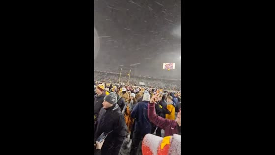 Snow-covered stadium erupts as fans celebrate winning the axe in Otter Tail, USA
