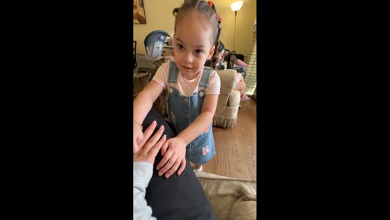 Little girl playfully taps author in New York, USA