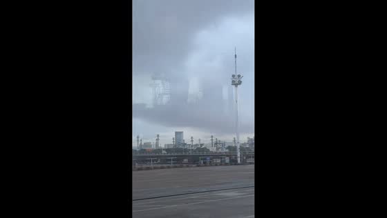 Steel structure perfectly reflected in clouds at Beilun Dock in Zhejiang, China