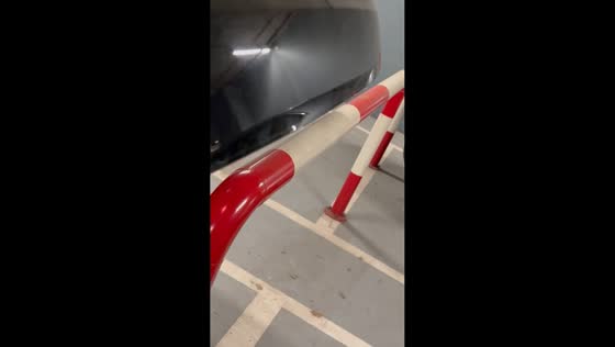 Car trunk closes with perfect clearance beside barrier in Belgrade, Serbia