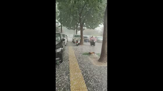 Severe hailstorm covers roads and vehicles in Shijiazhuang, Hebei, China