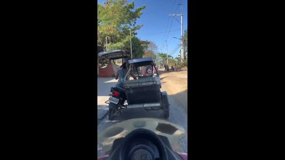 Leaning tricycle drives funny in Taytay, Rizal, Philippines