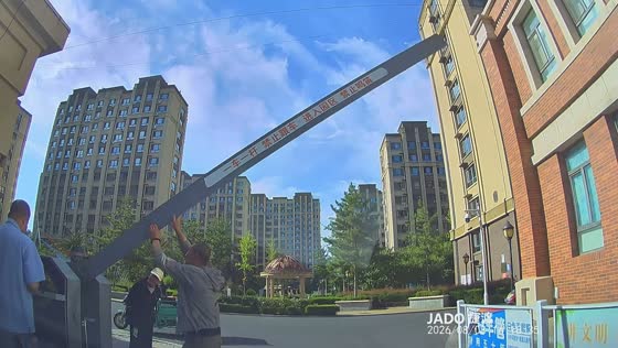 Elderly man lifts gate barrier for driver in Inner Mongolia, China