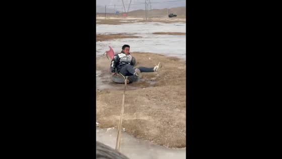 Man pulled by car and falls while playing on frozen river in Gansu, China