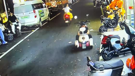 E-scooter rolls forward while rider checks seat compartment in Guangdong, China