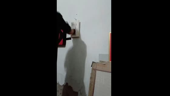 Traditional Chinese Kung Fu practitioner skillfully destroys book with lightning punches