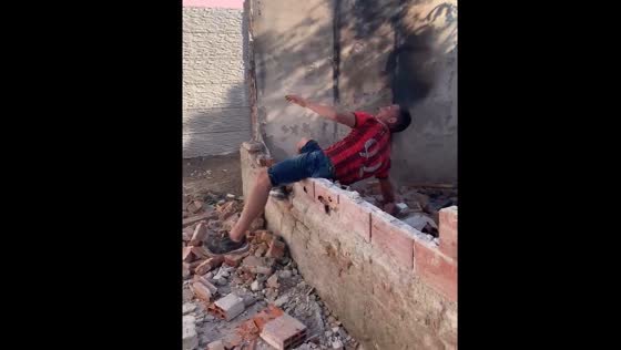 Funny incident in Buenos Aires as person falls while swinging sledgehammer at wall
