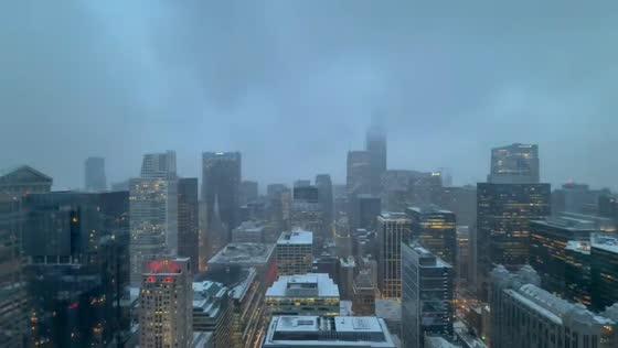 Snow-covered cityscape under heavy fog in Highland, Indiana, USA