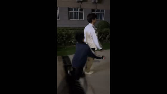 Man falls into an uncovered canal while walking in sync with his companion in Shaanxi, China