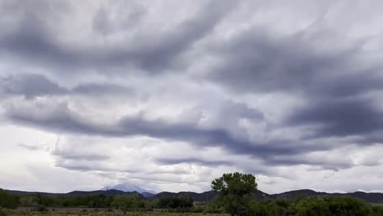 Heavy rain looms under dark clouds in Walsenburg, Colorado
