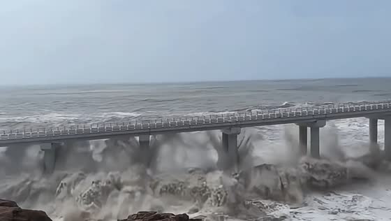 Massive waves batter coastal bridge as Super Typhoon Bavi nears Zhejiang, China